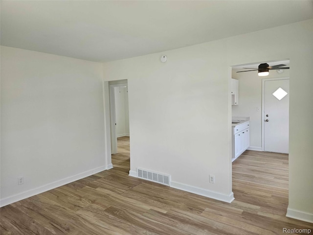 23723 Vassar Ave, Hazel Park, MI 48030 - empty room featuring light wood-style floors, ceiling fan, and a smoke detector