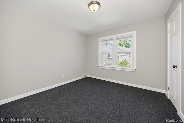 1122 Symes Ct, Royal Oak, MI 48067 - unfurnished bedroom with baseboards and dark colored carpet