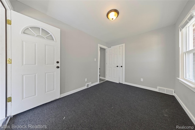 1122 Symes Ct, Royal Oak, MI 48067 - empty room featuring dark carpet and plenty of natural light