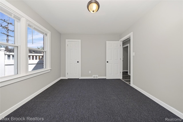 1122 Symes Ct, Royal Oak, MI 48067 - empty room with dark carpet and baseboards