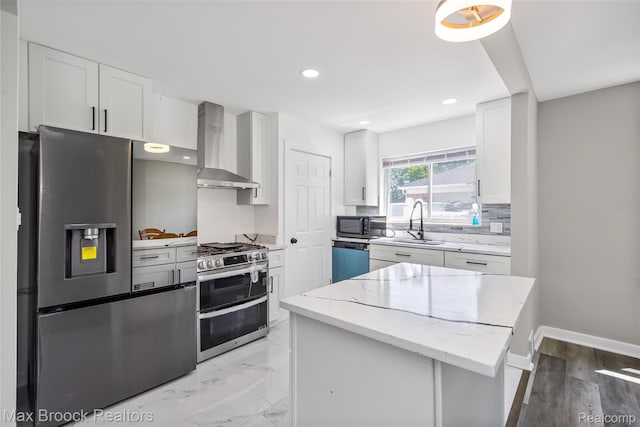 1122 Symes Ct, Royal Oak, MI 48067 - kitchen with wall chimney range hood, stainless steel appliances, white cabinetry, light stone counters, and recessed lighting