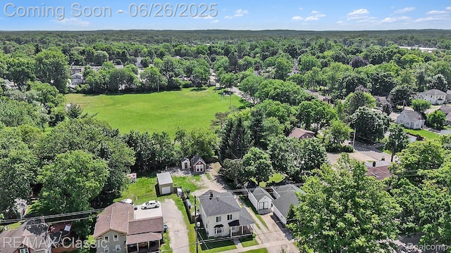 207 Washington St, Holly, MI 48442 - aerial view of residential area featuring a forest