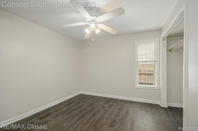207 Washington St, Holly, MI 48442 - unfurnished bedroom with dark wood-type flooring, a ceiling fan, and a closet