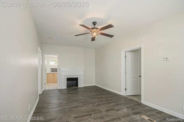207 Washington St, Holly, MI 48442 - unfurnished living room with a ceiling fan, dark wood-style floors, and a fireplace