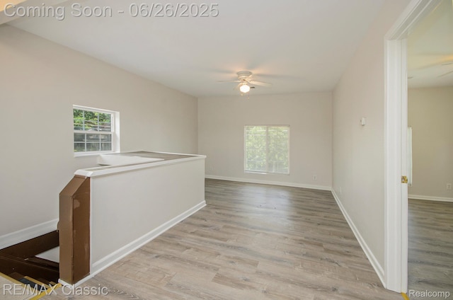207 Washington St, Holly, MI 48442 - spare room with a ceiling fan and light wood-type flooring