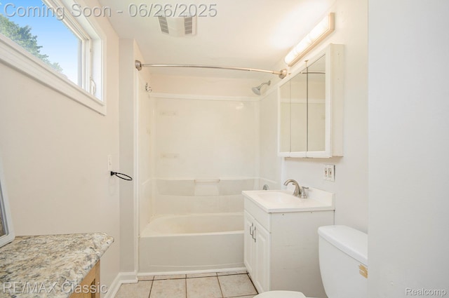 207 Washington St, Holly, MI 48442 - bathroom featuring vanity, tile patterned floors, and shower / tub combination