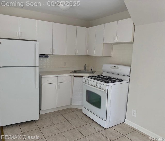 207 Washington St, Holly, MI 48442 - kitchen featuring white appliances, white cabinetry, light countertops, and light tile patterned flooring