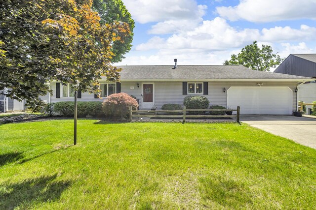 38 Evans Trl, Tipton, MI 49287 - view of front facade with a garage, a front lawn, and concrete driveway
