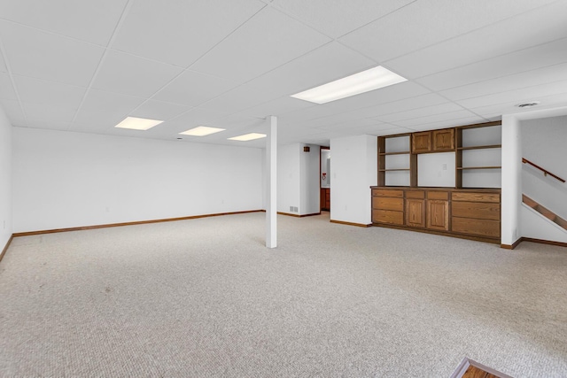 38 Evans Trl, Tipton, MI 49287 - finished below grade area featuring light carpet, a drop ceiling, and stairs