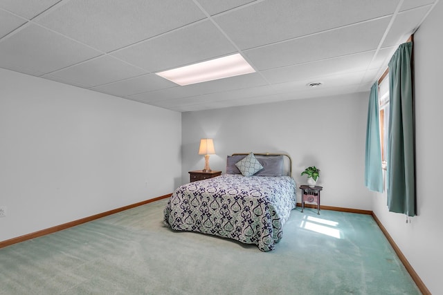 38 Evans Trl, Tipton, MI 49287 - carpeted bedroom with baseboards and a paneled ceiling