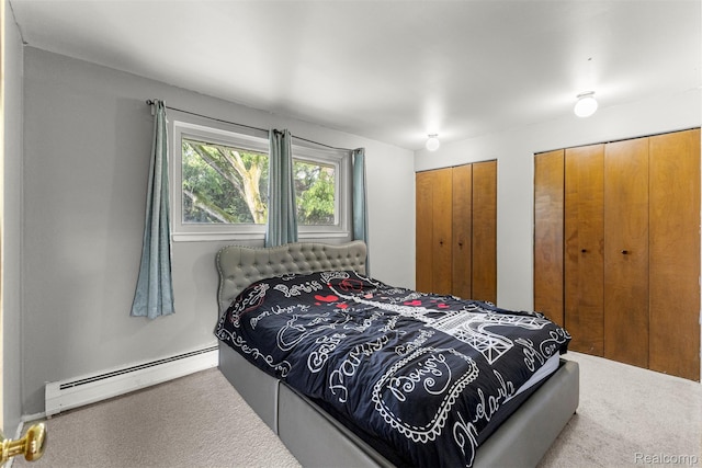 2738 Berry Dr, Bloomfield Hills, MI 48304 - carpeted bedroom with a baseboard radiator and two closets