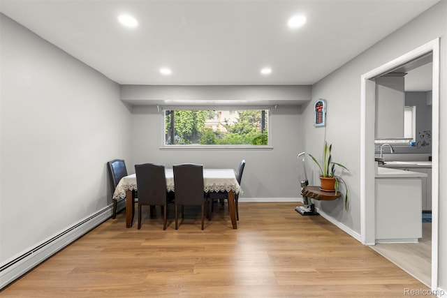 2738 Berry Dr, Bloomfield Hills, MI 48304 - dining room with a baseboard radiator, recessed lighting, and light wood finished floors