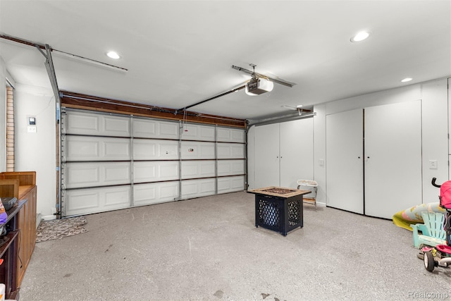 2738 Berry Dr, Bloomfield Hills, MI 48304 - garage featuring a garage door opener and recessed lighting