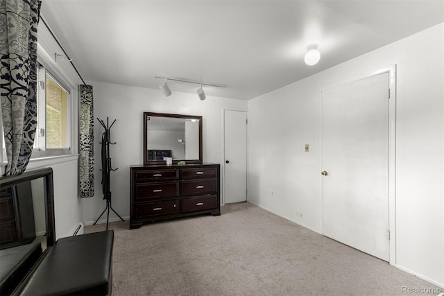 2738 Berry Dr, Bloomfield Hills, MI 48304 - carpeted bedroom featuring a baseboard radiator and track lighting