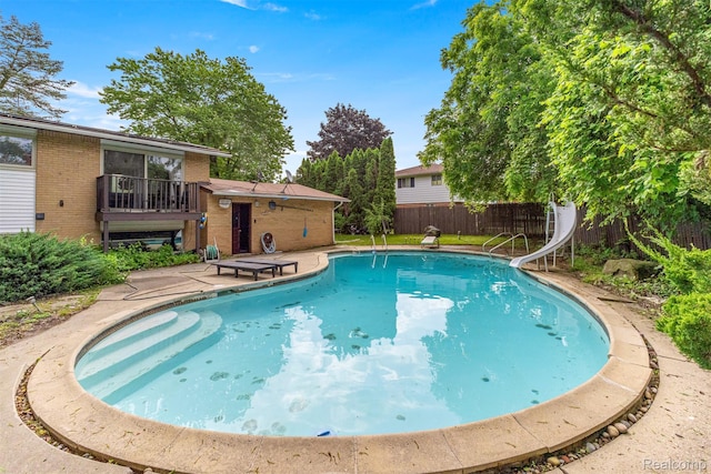 2738 Berry Dr, Bloomfield Hills, MI 48304 - view of pool featuring a water slide and a fenced backyard