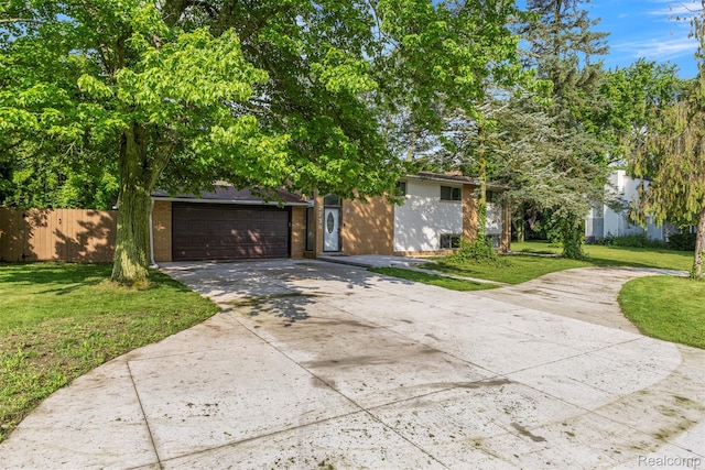 2738 Berry Dr, Bloomfield Hills, MI 48304 - obstructed view of property featuring concrete driveway, brick siding, and an attached garage