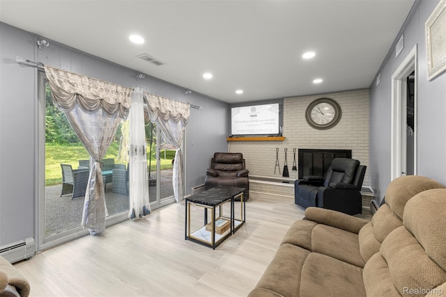 2738 Berry Dr, Bloomfield Hills, MI 48304 - living area featuring a baseboard heating unit, wood finished floors, recessed lighting, and a fireplace