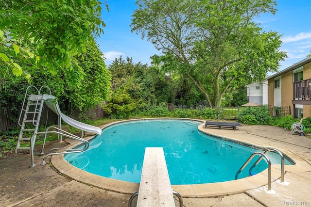 2738 Berry Dr, Bloomfield Hills, MI 48304 - view of swimming pool with a diving board, a water slide, and a patio area