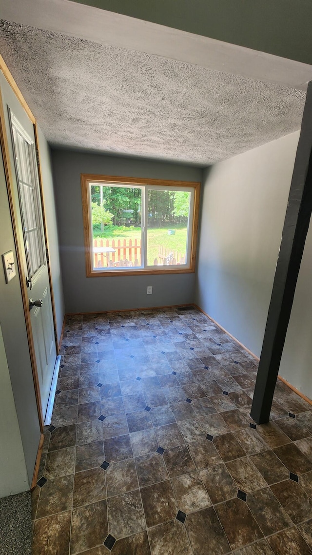 5213 S Newcosta Ave, Newaygo, MI 49337 - unfurnished room featuring a textured ceiling