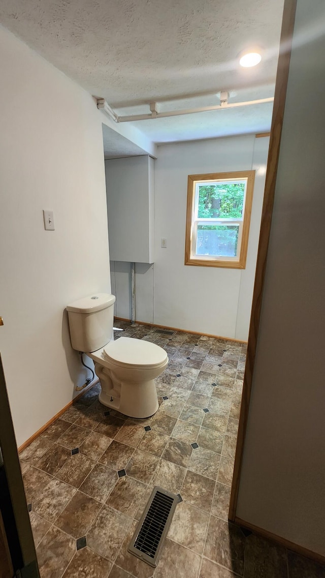 5213 S Newcosta Ave, Newaygo, MI 49337 - bathroom with a textured ceiling and toilet