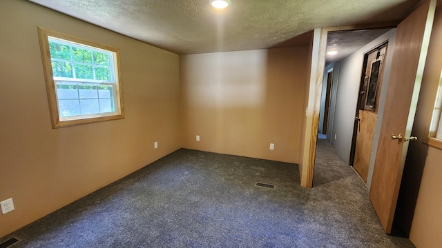 5213 S Newcosta Ave, Newaygo, MI 49337 - spare room featuring a textured ceiling and carpet floors