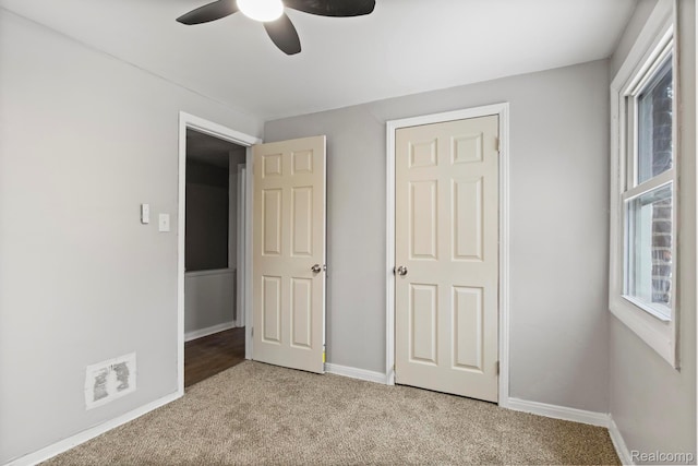 9110 Mansfield St, Detroit, MI 48228 - unfurnished bedroom with light carpet and a ceiling fan
