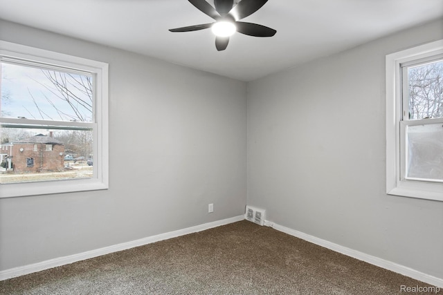 9110 Mansfield St, Detroit, MI 48228 - empty room featuring dark colored carpet and a ceiling fan