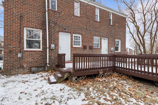 9110 Mansfield St, Detroit, MI 48228 - snow covered house featuring brick siding and a wooden deck