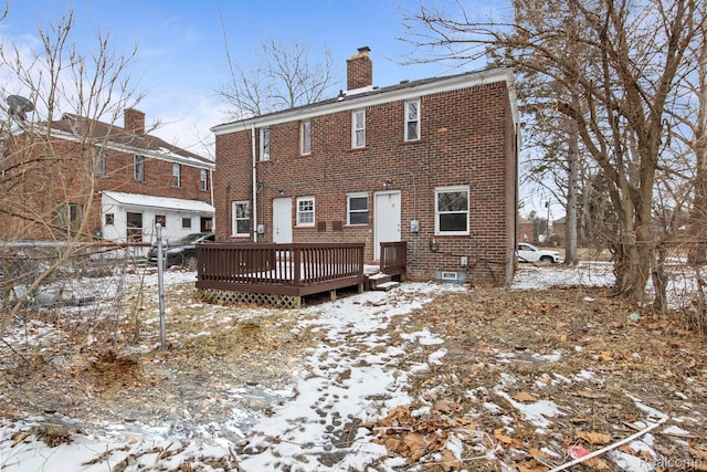 9110 Mansfield St, Detroit, MI 48228 - snow covered property with brick siding, a chimney, and a deck