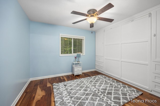 12865 S Englewright Dr, Sand Lake, MI 49343 - bedroom featuring dark wood-style floors, ceiling fan, and a closet