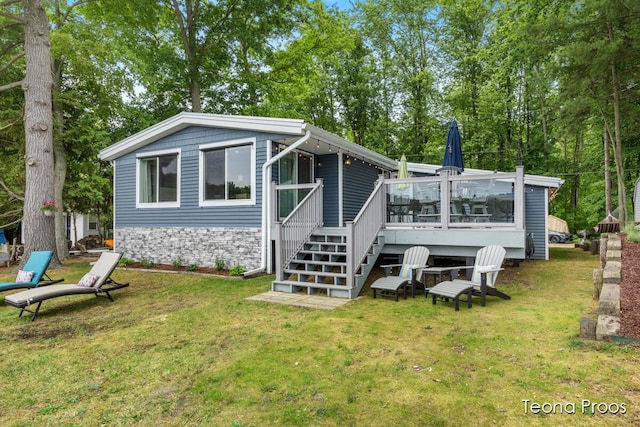 12865 S Englewright Dr, Sand Lake, MI 49343 - rear view of property featuring a yard