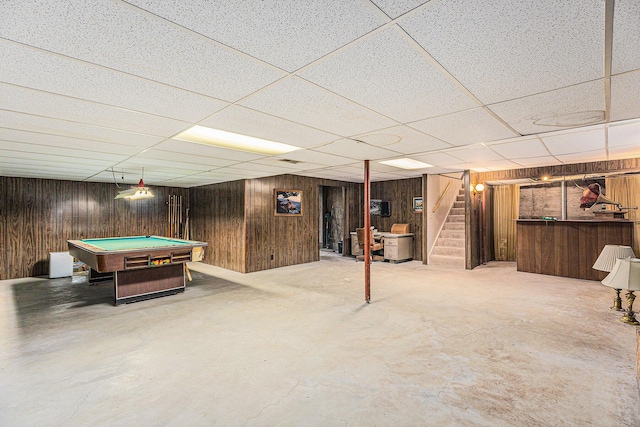 8025 Fosdick Rd, Saline, MI 48176 - rec room with wooden walls, a drop ceiling, billiards table, and concrete floors