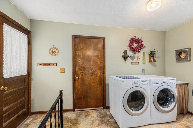 8025 Fosdick Rd, Saline, MI 48176 - laundry room featuring washer and clothes dryer and stone finish floors