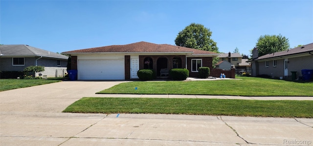 15480 Sherwood Ln, Fraser, MI 48026 - ranch-style house featuring an attached garage, brick siding, driveway, and a front yard