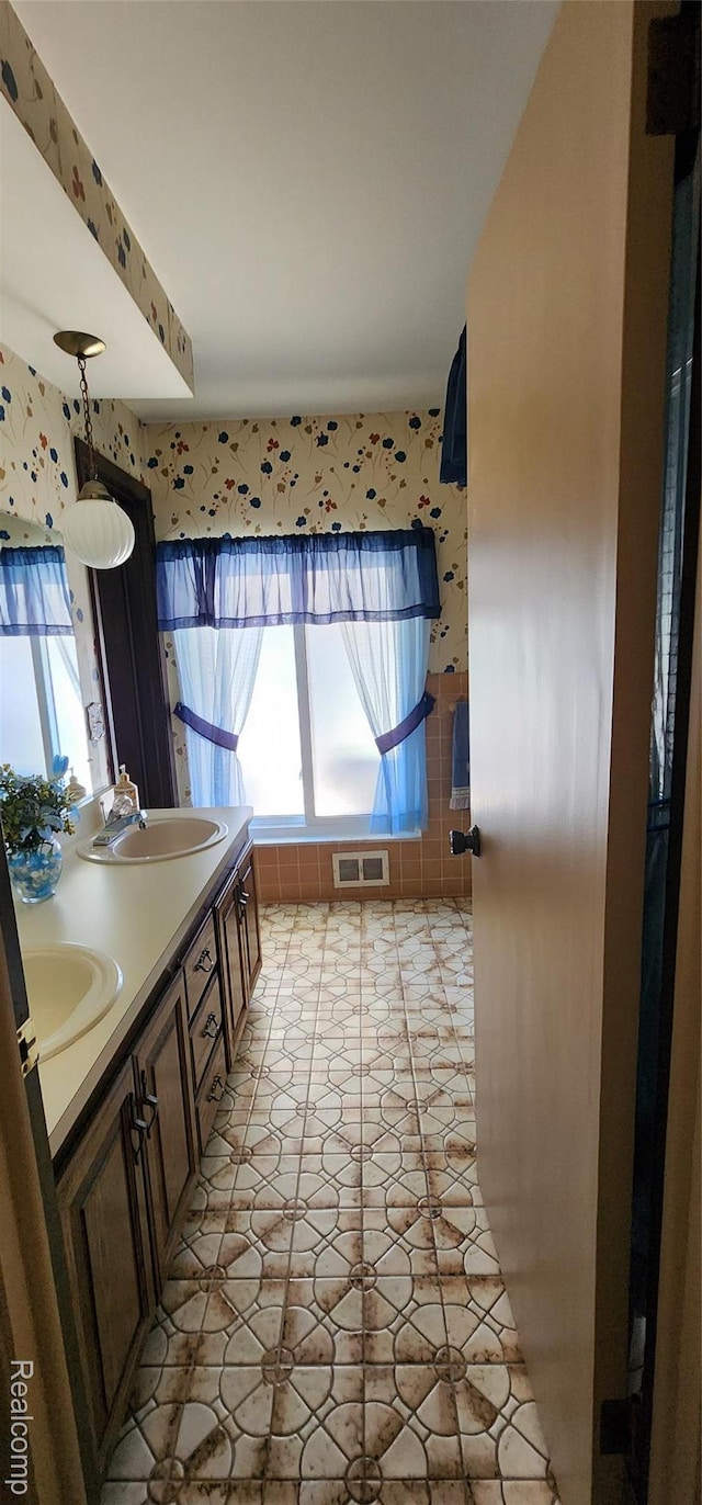 15480 Sherwood Ln, Fraser, MI 48026 - full bathroom with wallpapered walls and double vanity