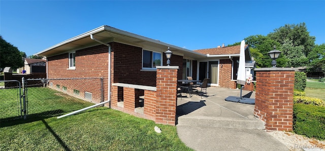 15480 Sherwood Ln, Fraser, MI 48026 - view of home's exterior featuring a patio and brick siding