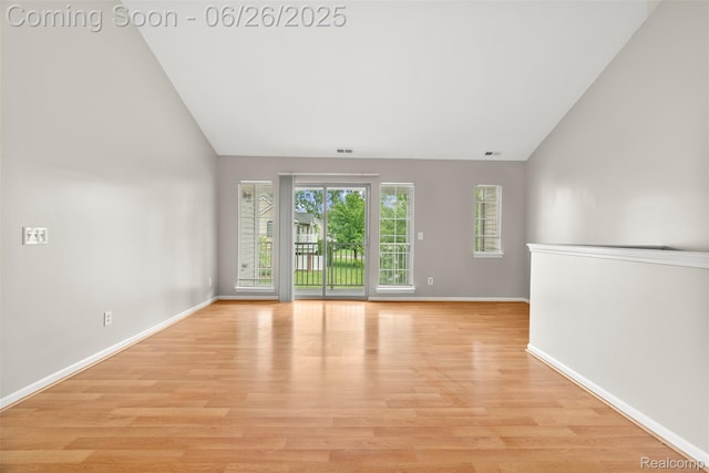 3343 Northpointe Blvd, Melvindale, MI 48122 - empty room featuring light wood-style flooring and high vaulted ceiling
