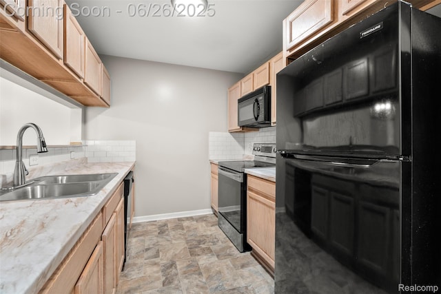 3343 Northpointe Blvd, Melvindale, MI 48122 - kitchen featuring black appliances, light brown cabinetry, backsplash, light countertops, and stone finish flooring