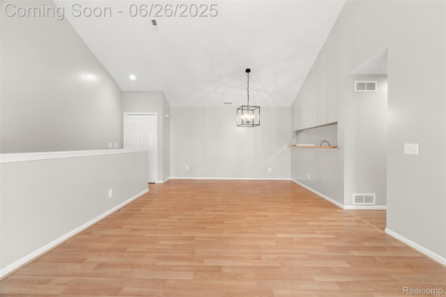 3343 Northpointe Blvd, Melvindale, MI 48122 - unfurnished dining area featuring lofted ceiling, a chandelier, light wood-style flooring, and recessed lighting