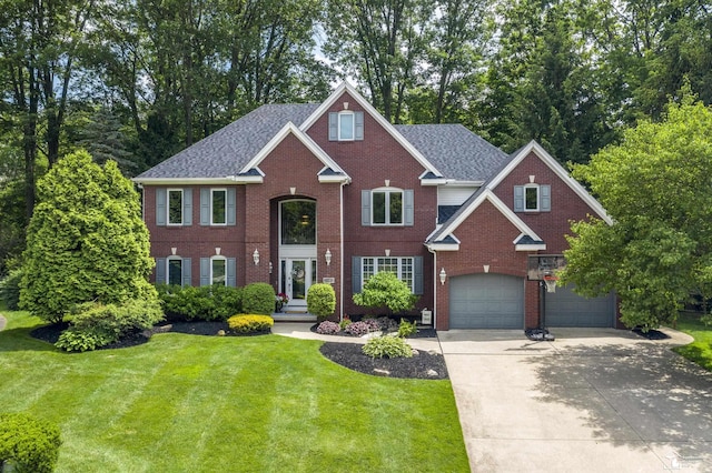 7145 S Valley Cir, Lambertville, MI 48144 - colonial-style house featuring a garage, driveway, a front lawn, and brick siding