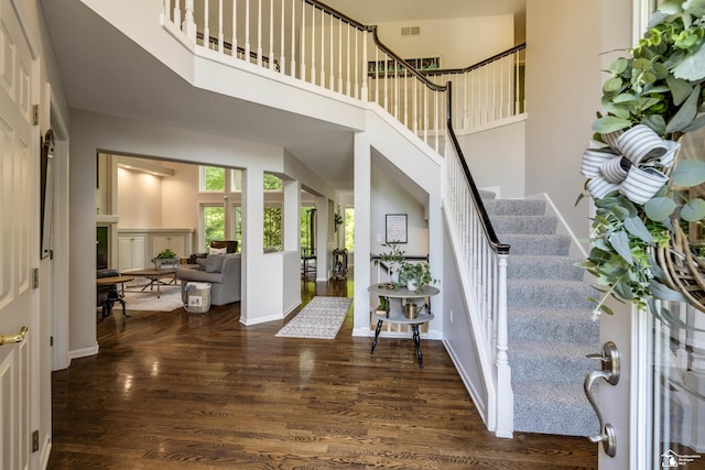7145 S Valley Cir, Lambertville, MI 48144 - foyer with wood finished floors, stairway, and a high ceiling