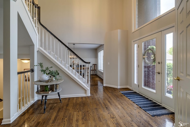 7145 S Valley Cir, Lambertville, MI 48144 - foyer entrance with wood finished floors, a high ceiling, and stairs