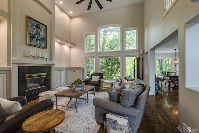7145 S Valley Cir, Lambertville, MI 48144 - living area featuring a high ceiling, ceiling fan, dark wood-style floors, a fireplace, and recessed lighting