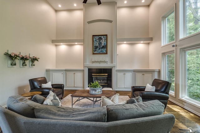 7145 S Valley Cir, Lambertville, MI 48144 - living area featuring a towering ceiling, wood finished floors, and a tile fireplace