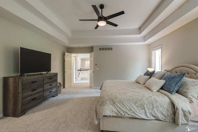 7145 S Valley Cir, Lambertville, MI 48144 - bedroom featuring a tray ceiling, light carpet, and ceiling fan