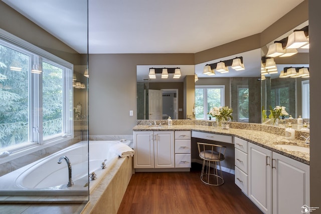 7145 S Valley Cir, Lambertville, MI 48144 - bathroom featuring double vanity, a bath, and wood finished floors