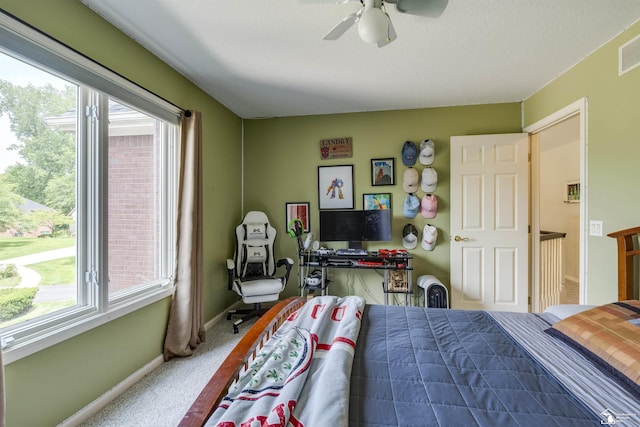 7145 S Valley Cir, Lambertville, MI 48144 - carpeted bedroom featuring multiple windows and a ceiling fan