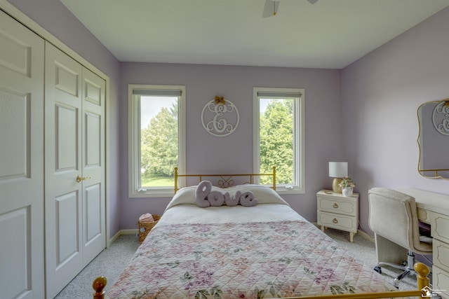7145 S Valley Cir, Lambertville, MI 48144 - bedroom featuring light carpet, multiple windows, a closet, and ceiling fan