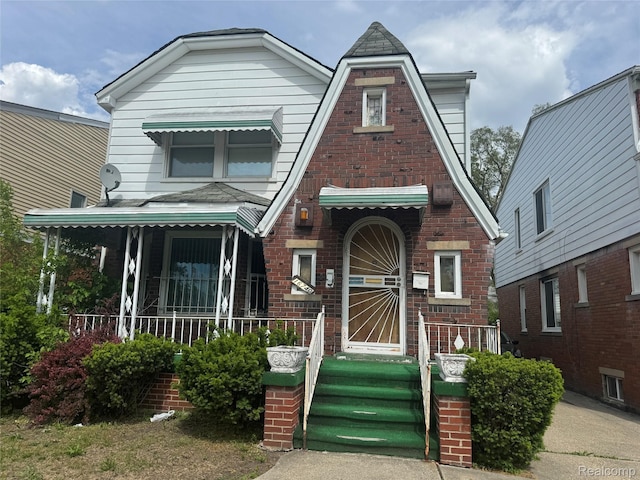 16740 Woodingham Dr, Detroit, MI 48221 - view of front facade with covered porch and brick siding