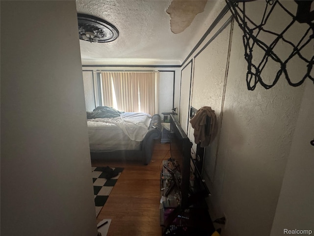16740 Woodingham Dr, Detroit, MI 48221 - bedroom featuring a textured ceiling, wood finished floors, and a textured wall